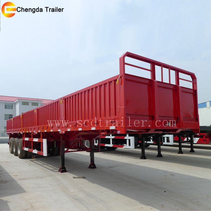 Side Gate and Fence Truck Driving Large Cargo Trailer 